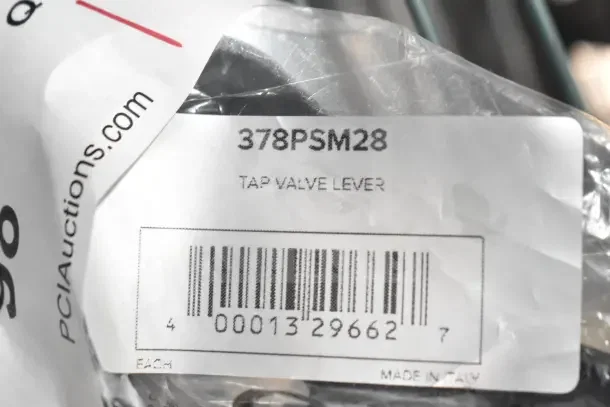 Brand new scratch and dent 378PSM28 tap valve lever, labeled "Made in Italy," with barcode for identification.