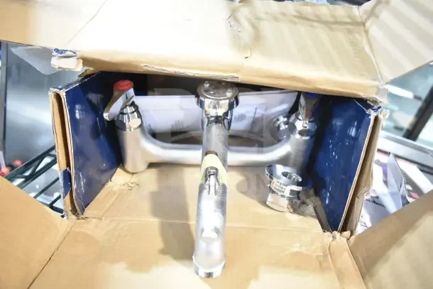 BRAND NEW T&S B-0665-BSTP Service Sink Faucet with built-in stops, vacuum breaker, and lever handles, in original box.