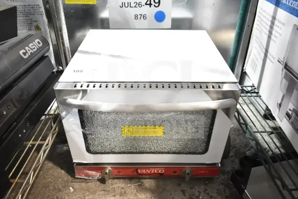 Brand new Avantco 177CO14 countertop convection oven, 0.8 cu. ft., shows glass damage. 120 volts, 1 phase.