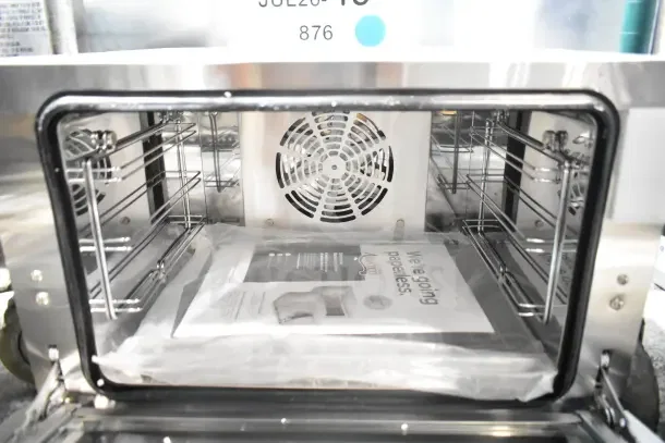 Brand new Avantco 177CO14 quarter-size countertop convection oven. Glass damage noted. 0.8 Cu. Ft., 120V, 1 Phase.