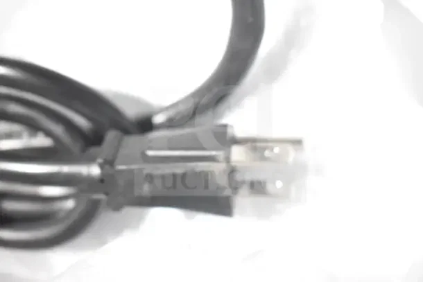 Close-up of a black power plug and cord, part of the Avantco 177CO14 countertop convection oven.