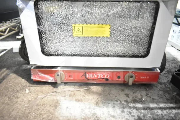 Brand new Avantco 177CO14 countertop convection oven, 0.8 cu. ft., with visible glass damage, 120V, 1 Phase.