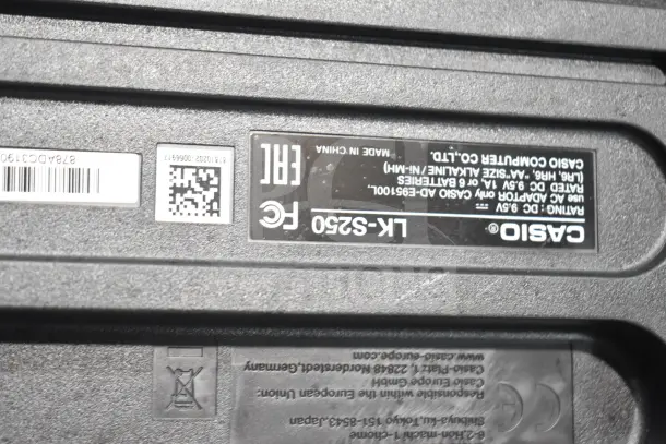 Seven various keyboards including a Rock Jam RJ640 and Casiotone LK-S250. Label shows Casio LK-S250 details, including power requirements.