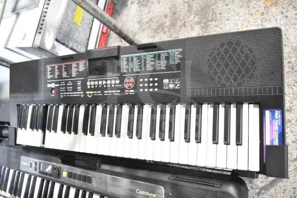 Seven assorted keyboards including Rock Jam RJ640 and Casiotone LK-S250, in used condition. Various controls and rhythms shown.