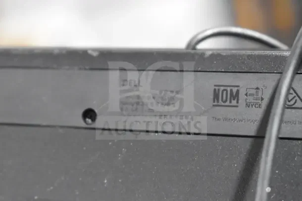 Close-up of a Dell keyboard showing branding and certification markings. Part of a lot of 7 various computer keyboards.