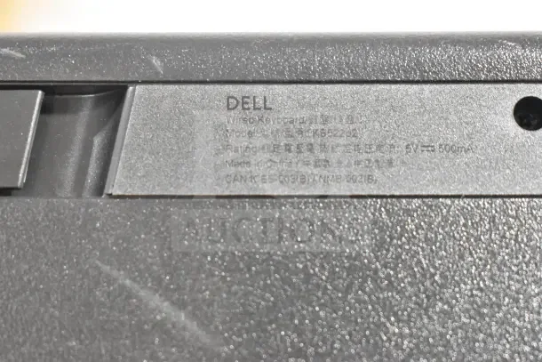 Close-up of a Dell wired keyboard label, model KB522p2, 5V, 500mA. Made in China. Part of a lot of 7 computer items.