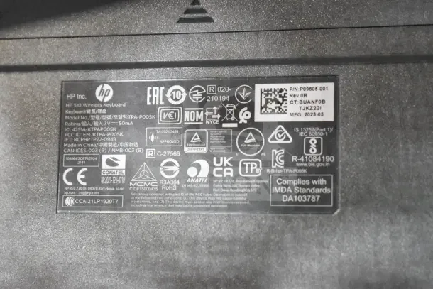 HP S10 Wireless Keyboard label showing model TPA-P005K, FCC ID EMJKTPA-P005K, and compliance markings.