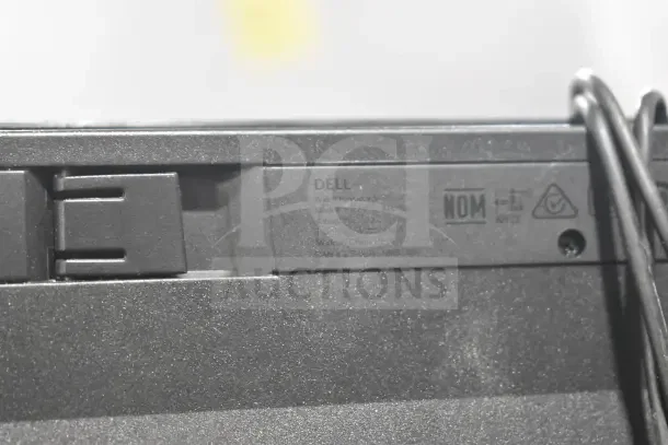 Dell keyboard label showing model KB-113P, 5V 100mA, various certifications, and "Made in China" marking.