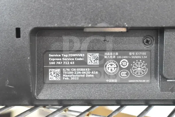Label on Dell E1715S monitor showing service tag 7DWVB3, express service code, and manufacture date February 2022.