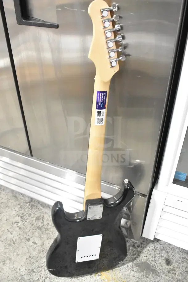 Two Rock Jam electric guitars, black body, natural wood neck, chrome tuning pegs, and visible label with details.