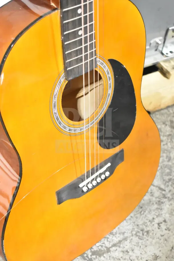 Two Rock Jam acoustic guitars, natural wood finish, black pickguard, excellent condition, visible strings and bridge.