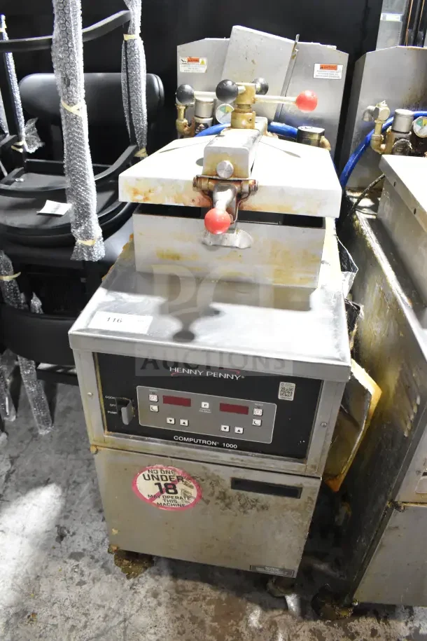 Henny Penny 600 commercial gas pressure fryer on casters, 80,000 BTU. Visible wear, label states "No one under 18 may operate."