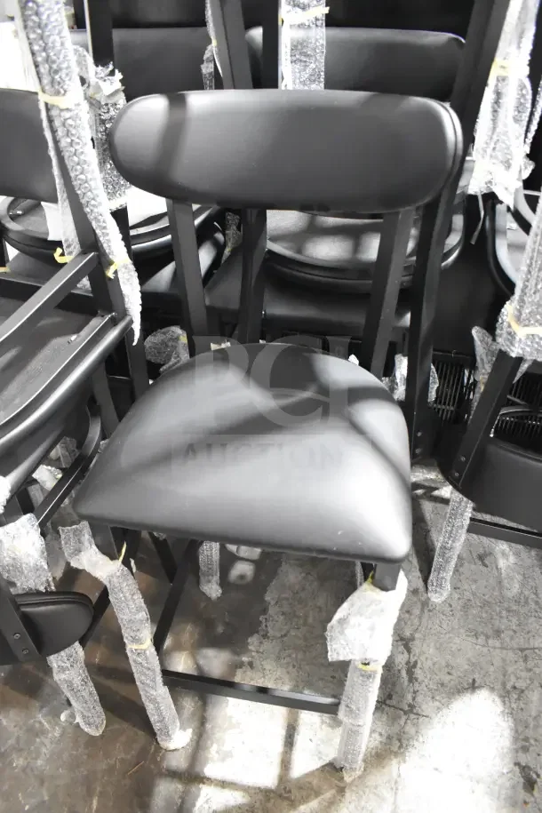 10 new Lancaster Boomerang bar stools, black finish with vinyl seat and back. Scratch and dent condition, bubble-wrapped.