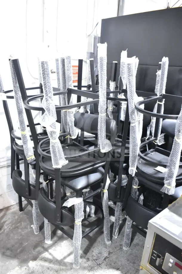 10 brand new Lancaster Boomerang Series bar stools, black finish with black vinyl seats, wrapped for shipping, minor dents.
