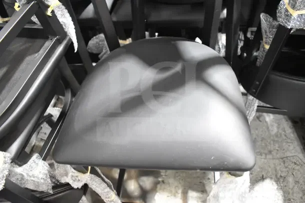 10 new Lancaster Boomerang Series bar stools with black vinyl seat, scratch and dent condition, wrapped in protective material.