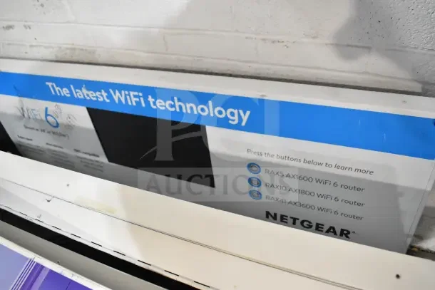 Netgear WiFi 6 technology display, showing RAX5, RAX10, RAX41 routers. Features latest innovations in wireless connectivity.