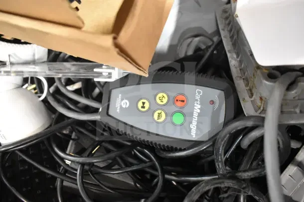 Pallet lot with various items including Sensormatic ZBSMPROE and computer keyboard, tangled cables and devices; mixed condition.
