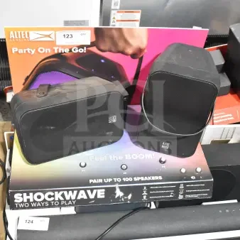 Altec Lansing store display featuring two speakers, labeled "Party On The Go." Includes "Shockwave" branding.
