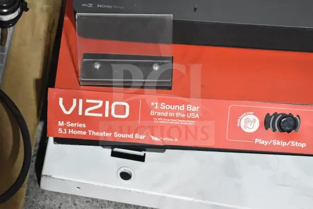 Vizio M-Series 5.1 Home Theater Sound Bar store display, model M51ax-J6, features Play/Skip/Stop dial, Dolby Atmos logo.