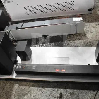 LG sound bar and speakers on store display, featuring HDMI, dts, and Dolby audio support; displays minimal wear.