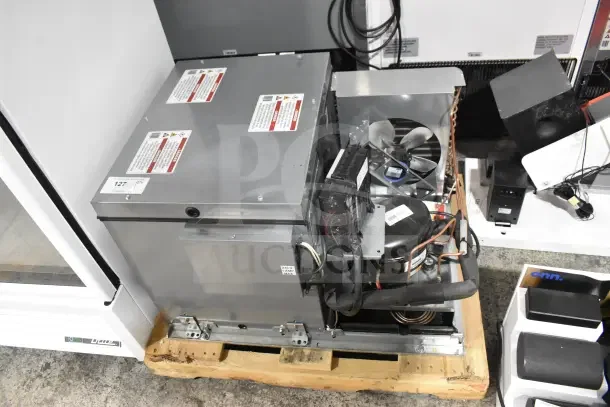 Brand new 2026 True REFDECK-M-2 commercial condensing unit for cooler, 208-240V, 1 phase, with minor scratches and dents.