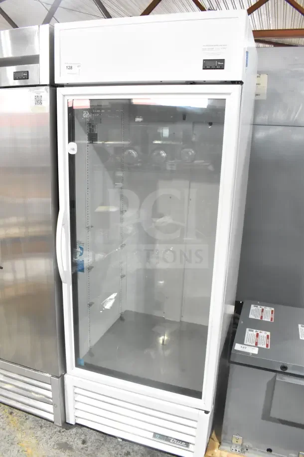 2021 True TSCI-600R-G-PH reach-in cooler, single glass door, 115V, 1 phase, excellent condition, clear interior view.