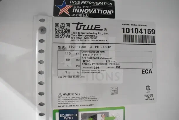 2021 True TSCI-600R-G-PH cooler merchandiser label. Features 115 volts, 1 phase. Serial number 10104159.
