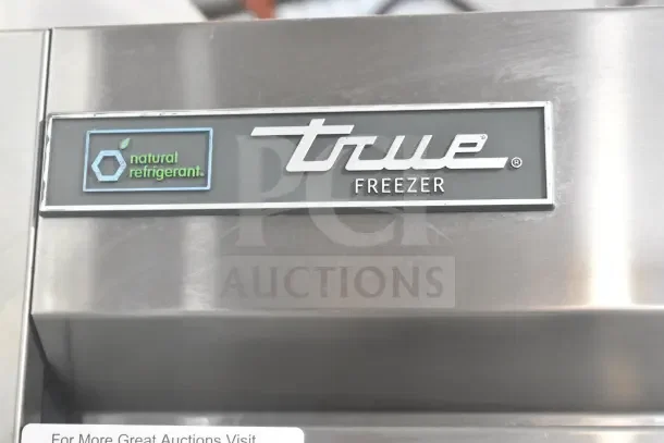 2022 True T-19F-HC freezer label with "True Freezer" and "natural refrigerant" markings, stainless steel finish.