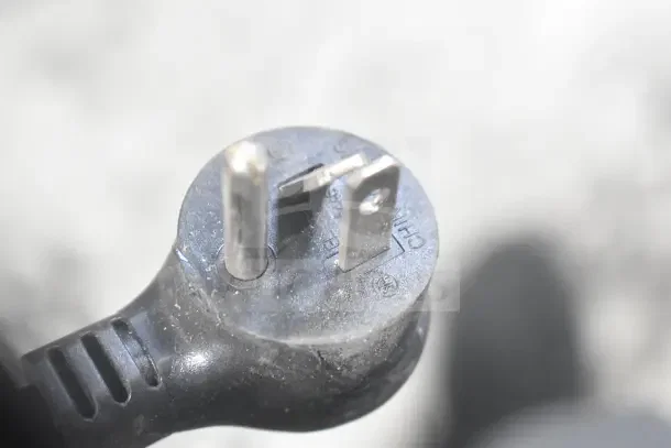 Close-up of a three-prong power plug for the 2022 True T-19F-HC Commercial Freezer, 115 Volts, 1 Phase.