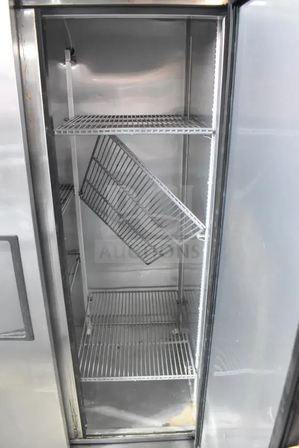 2017 True T-35 commercial 2-door reach-in cooler on casters, features adjustable shelves, 115 volts, 1 phase.