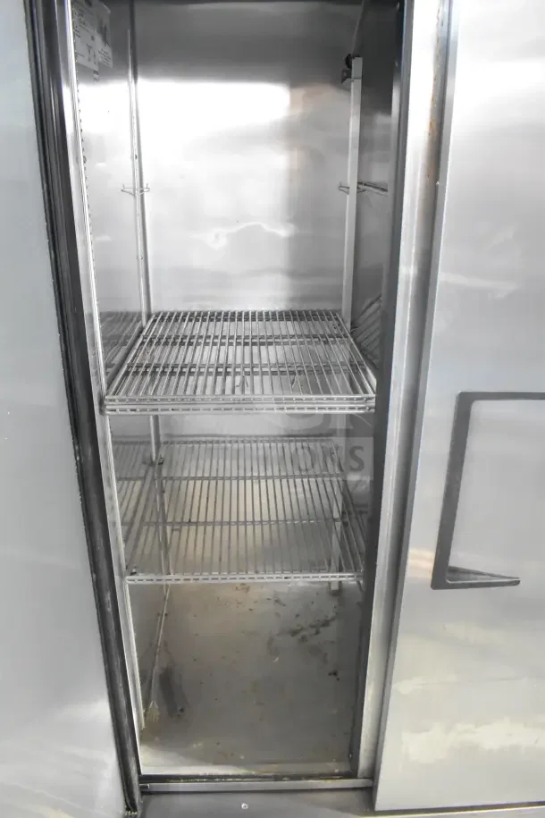 2017 True T-35 commercial 2-door cooler, stainless steel interior, on casters, 115V, 1 phase, visible shelving, used condition.