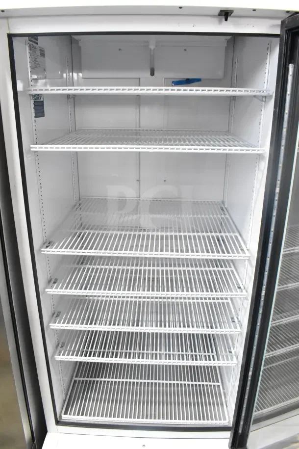 2021 True TSCI-600R-G-PH commercial cooler, single door, glass front, 115V, excellent condition, spacious shelving.