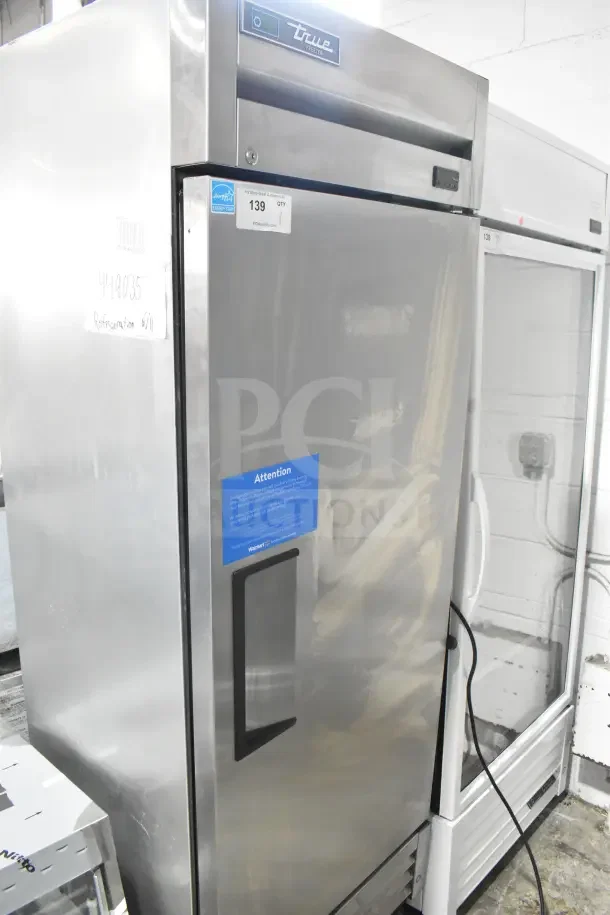2018 True T-19F-HC commercial reach-in freezer with single door, some caster damage. 115 volts, 1 phase.