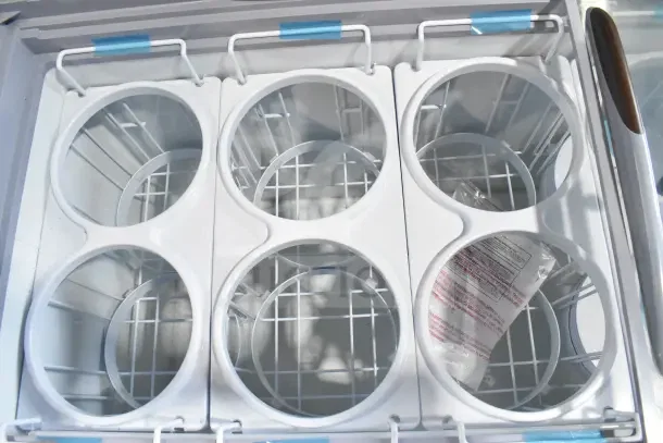 Brand new Avantco commercial chest freezer with 115V, 1 Phase. Visible dividers, scratches, and dents. Ideal for merchandising.