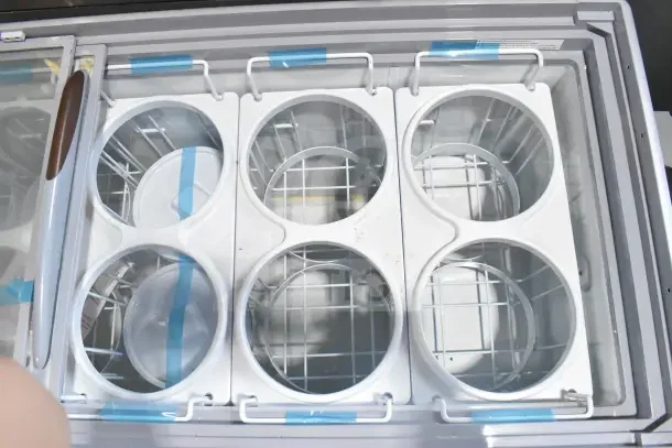 Brand new Avantco commercial chest freezer merchandiser, 115 volts, 1 phase. Scratch and dent condition. Interior basket layout visible.