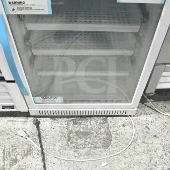Accucold ARG6PV Mini Cooler Merchandiser, 110V, 1 Phase, glass door, shelves visible, caution labels present.