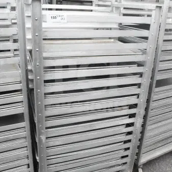 Two commercial pan transport racks with 70 baking pans, metal construction, wheeled base, excellent condition.