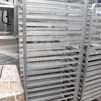 Two commercial pan transport racks, metal, multiple shelves, on casters for mobility, used condition, auction item 159 labeled.