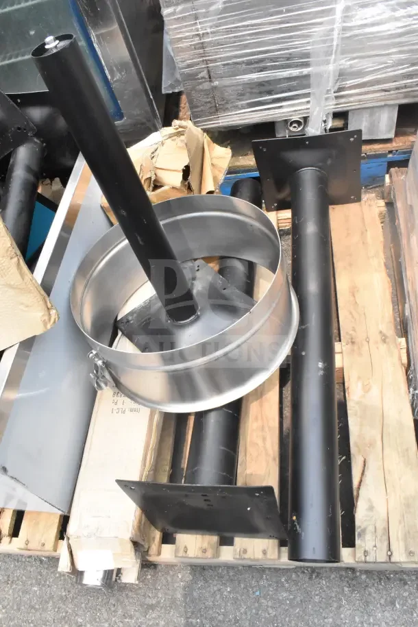 12 new scratch and dent items including black metal table base pieces and a round stainless steel ice bin on a pallet.