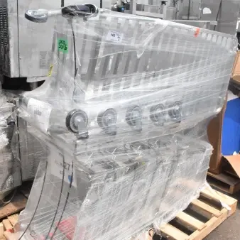 6 brand new scratch and dent items including shopping carts and pan rack, wrapped in plastic, on a wooden pallet.