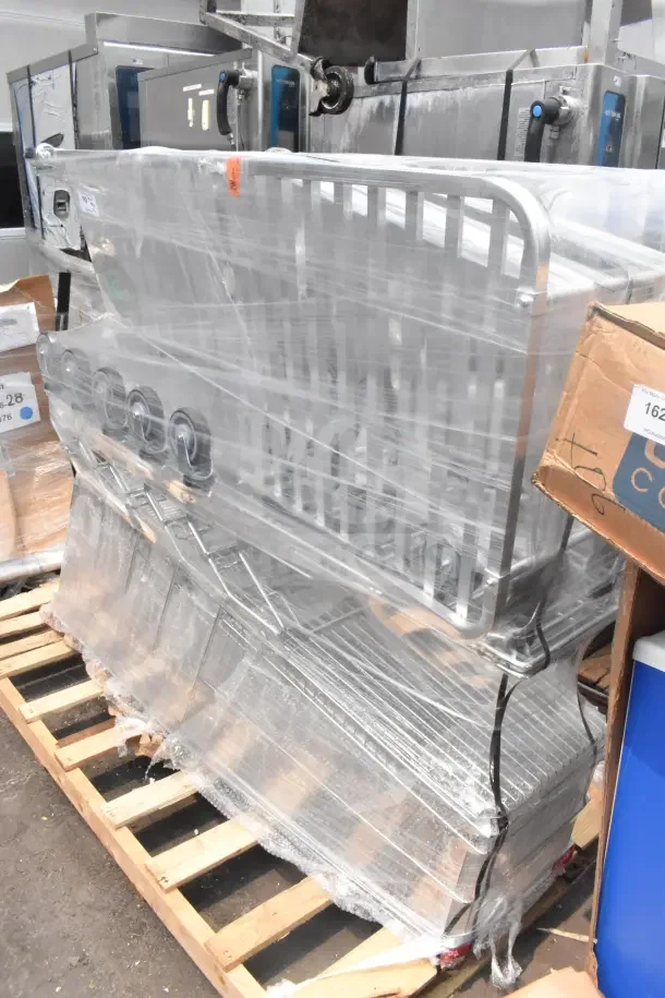 6 brand new items including shopping carts and pan rack, wrapped in plastic on wooden pallet, labeled as scratch and dent.