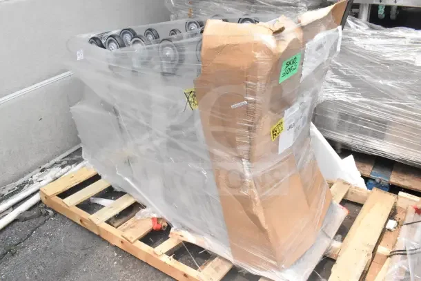 Plastic-wrapped stack of 5 new Regency Supermarket Shopping Carts, 6.3 cu. ft., on pallet with visible "SKID 2 OF 5" label.