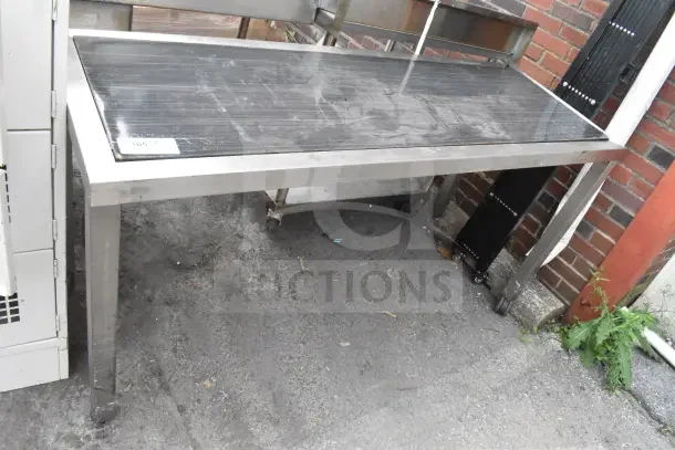Black and Chrome Finish Table, rectangular, metal frame, visible wear on surface, auction tag attached.