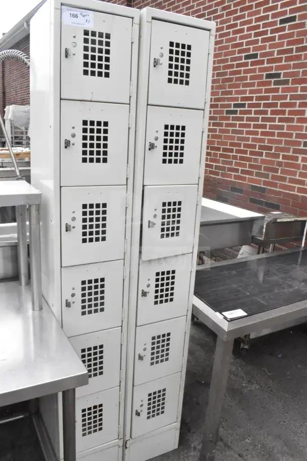 2 tan six-cubby lockers, metal, vented doors, visible number tag, used condition, durable storage solution.