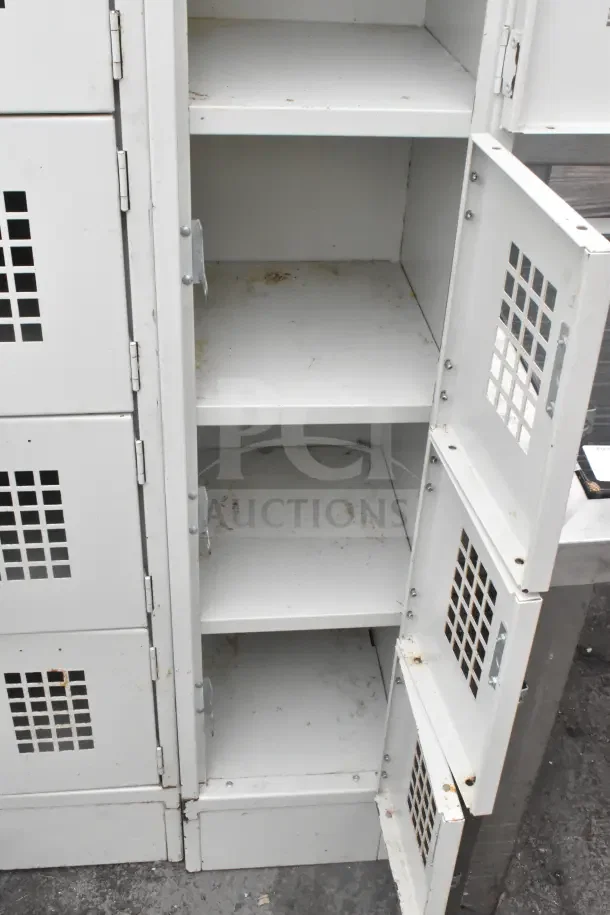 Tan 6-cubby metal locker, dual set. Ventilated doors, visible wear and rust. Auction offers double your bid.