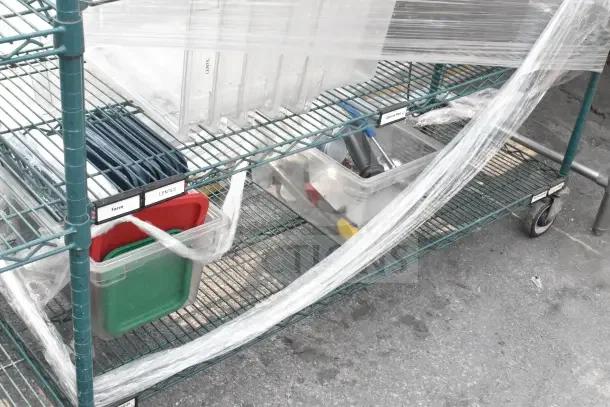 Green wire shelving unit with five tiers on commercial casters, includes plastic bins labeled "Farro" and "Lentils."