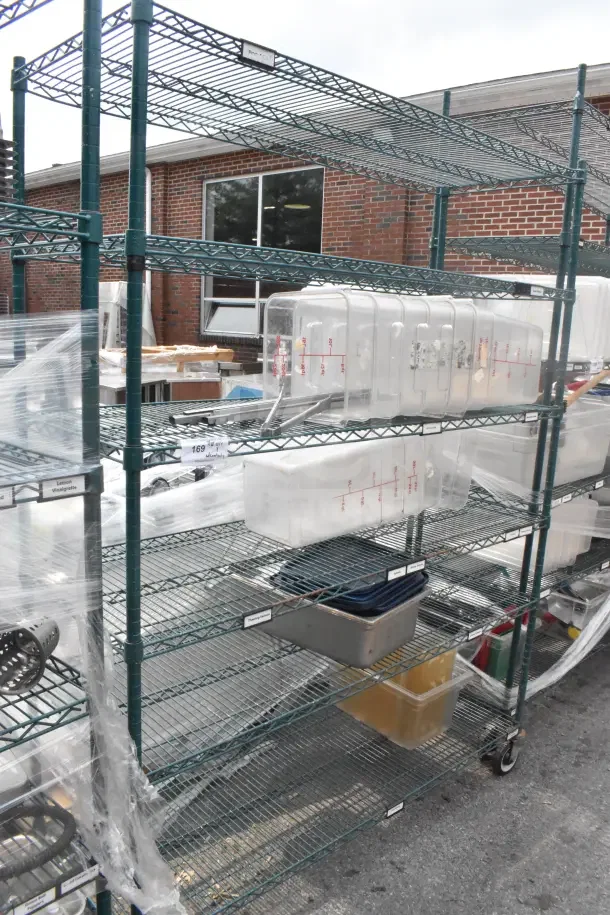 Green finish 6-tier wire shelving unit on commercial casters, filled with various bins; buyer must dismantle.