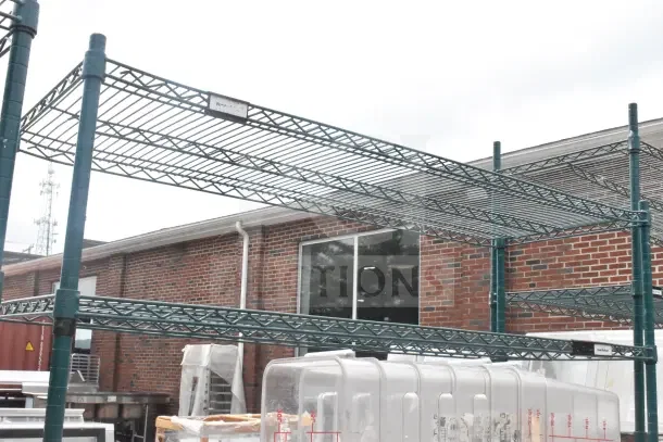 Green 6-tier wire shelving unit on commercial casters, includes contents like bins. Buyer must dismantle.