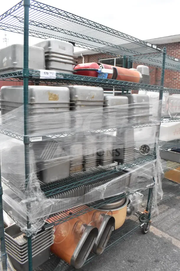 Green 6-tier wire shelving unit with commercial casters, holds drop-in bins. Buyer dismantles, freight charges apply.