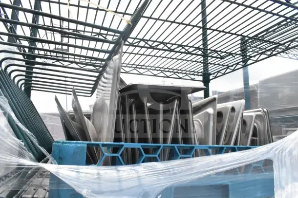 5-tier green wire shelving unit on commercial casters, includes drop-in bin lids. Buyer must dismantle for shipping.